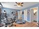 Spacious office with a desk, two monitors, a stylish ceiling fan, and an ensuite bathroom at 1115 Riverbend Club Se Dr, Atlanta, GA 30339