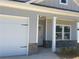 Detailed view of the home's entrance showcasing stone accents and a white-trimmed front porch at 121 Sunflower Cir, Cartersville, GA 30121