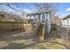 Fenced backyard featuring a wooden deck with stairs leading to the lawn at 1146 Sims Sw St, Atlanta, GA 30310