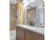 Bathroom showcasing a shower with tub, large mirror, and light-colored tile at 1146 Sims Sw St, Atlanta, GA 30310