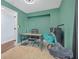 Green office/bedroom featuring carpet, desk, chair, and accent bicycle at 1146 Sims Sw St, Atlanta, GA 30310