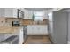 Kitchen featuring stainless steel appliances, granite countertops, and white cabinets at 1146 Sims Sw St, Atlanta, GA 30310
