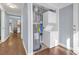Laundry closet featuring a stacked washer and dryer and a hot water tank at 1146 Sims Sw St, Atlanta, GA 30310