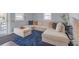 Spacious living room with stylish sectional sofa and plush blue carpet at 1146 Sims Sw St, Atlanta, GA 30310
