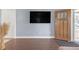 Living room with hardwood floors, a large TV, and stylish decor creating a comfortable space at 1146 Sims Sw St, Atlanta, GA 30310