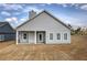 Single-story home with covered porch and large back yard at 121 Sunflower Cir, Cartersville, GA 30121