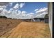 Expansive backyard with beautiful sky views and the frame of another house being built in the background at 121 Sunflower Cir, Cartersville, GA 30121