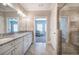 Well-lit bathroom featuring a double vanity, granite countertop, stylish fixtures and walk-in shower at 121 Sunflower Cir, Cartersville, GA 30121