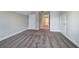 Bedroom with neutral walls, plush carpet, and paneled doors at 121 Sunflower Cir, Cartersville, GA 30121