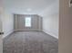 Bedroom with neutral walls, plush carpet, and a window at 121 Sunflower Cir, Cartersville, GA 30121