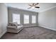 Bedroom boasts natural light with a cozy sitting area and neutral carpet at 121 Sunflower Cir, Cartersville, GA 30121