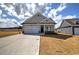 Charming single-story home with a gray facade and a two-car garage at 121 Sunflower Cir, Cartersville, GA 30121