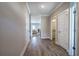 Inviting hallway with hardwood floors leading to the living area and bathroom at 121 Sunflower Cir, Cartersville, GA 30121
