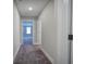Hallway featuring neutral paint, carpeted floor and white trim at 121 Sunflower Cir, Cartersville, GA 30121