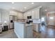 Open kitchen with granite countertops, stainless steel appliances, and eat-in breakfast bar at 121 Sunflower Cir, Cartersville, GA 30121