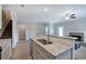 Open kitchen with granite countertops, stainless steel sink, and stairs to the second floor at 121 Sunflower Cir, Cartersville, GA 30121