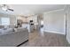 Spacious living room showcases white cabinets, stainless steel appliances, and hardwood floors at 121 Sunflower Cir, Cartersville, GA 30121