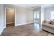 Bright living room with hardwood floors and a doorway to the bedroom at 121 Sunflower Cir, Cartersville, GA 30121