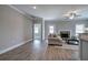 Bright and airy living room features a stone fireplace and backyard access at 121 Sunflower Cir, Cartersville, GA 30121