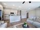 Open-concept kitchen and living room is bright and modern with hardwood flooring at 121 Sunflower Cir, Cartersville, GA 30121