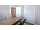Office space with a modern wooden desk and neutral walls at 121 Sunflower Cir, Cartersville, GA 30121