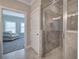 Walk-in shower with glass enclosure, tile surround, built-in niche and modern showerhead at 121 Sunflower Cir, Cartersville, GA 30121