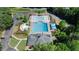 Aerial view of the community pool, complete with lounge areas and shady umbrellas at 426 Lakestone Dr, Suwanee, GA 30024