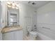 Bright bathroom featuring a granite countertop vanity and a shower-tub combo at 475 Cascade Rise Sw Ct, Atlanta, GA 30331