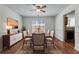 Formal dining room with stylish furniture set and modern lighting at 475 Cascade Rise Sw Ct, Atlanta, GA 30331
