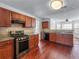 Well-equipped kitchen features stainless steel appliances, granite countertops, and ample cabinet space at 475 Cascade Rise Sw Ct, Atlanta, GA 30331