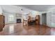 Spacious main bedroom features a brick fireplace, ceiling fan and gleaming hardwood floors at 475 Cascade Rise Sw Ct, Atlanta, GA 30331