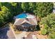 Aerial image showcasing a community pool nestled among trees, providing residents a private and picturesque recreational oasis at 730 Pear Grove Pl, Marietta, GA 30066