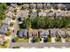 A neighborhood aerial view shows neat rows of homes set among lush trees, illustrating suburban planning and community harmony at 730 Pear Grove Pl, Marietta, GA 30066