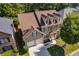 Aerial view of a two-story home showcasing its landscaped yard and attached two-car garage at 730 Pear Grove Pl, Marietta, GA 30066