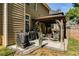 Backyard patio featuring a covered pergola, grill, and outdoor seating area at 730 Pear Grove Pl, Marietta, GA 30066