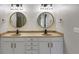 Bathroom vanity has double sinks, mirrors and modern light fixtures at 730 Pear Grove Pl, Marietta, GA 30066