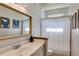 Charming bathroom with a rustic wood-framed mirror and modern fixtures at 730 Pear Grove Pl, Marietta, GA 30066