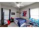 bedroom featuring playful decor, a ceiling fan, and plenty of natural light at 730 Pear Grove Pl, Marietta, GA 30066