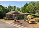 Image featuring a charming community clubhouse, complete with a playground, perfect for Gathering fun and neighborhood gatherings at 730 Pear Grove Pl, Marietta, GA 30066