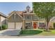 Charming two-story home with a well-manicured lawn, a two-car garage, and a welcoming red front door at 730 Pear Grove Pl, Marietta, GA 30066