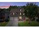 Charming two-story home with a well-manicured lawn, two-car garage, and a welcoming red door, blending comfort and curb appeal at 730 Pear Grove Pl, Marietta, GA 30066