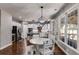 Open concept kitchen featuring a dining area, stainless steel appliances, granite counters and hardwood floors at 730 Pear Grove Pl, Marietta, GA 30066