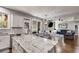 Open kitchen with granite island, stainless appliances, eat-in area and hardwood floors at 730 Pear Grove Pl, Marietta, GA 30066
