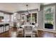 Eat-in kitchen area with white cabinets, granite countertops, stainless steel appliances and views of the backyard at 730 Pear Grove Pl, Marietta, GA 30066