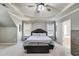 Spacious main bedroom features a trey ceiling, a fan and lots of windows at 730 Pear Grove Pl, Marietta, GA 30066