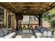 Covered pergola with outdoor seating, bar, and fan; great for entertaining at 730 Pear Grove Pl, Marietta, GA 30066