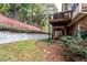 Backyard featuring a wooden deck and well-maintained tiered landscaping with a retaining wall at 2471 Bridlewood Se Dr # 8, Atlanta, GA 30339