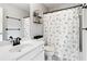 Bright bathroom with a shower/tub combination and a black and white animal print shower curtain at 2471 Bridlewood Se Dr # 8, Atlanta, GA 30339