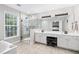 Bright bathroom features double sinks, a glass shower, and tile floors at 2471 Bridlewood Se Dr # 8, Atlanta, GA 30339