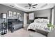 Bedroom showcases neutral gray tones, a crib, and playful animal artwork on the walls at 2471 Bridlewood Se Dr # 8, Atlanta, GA 30339